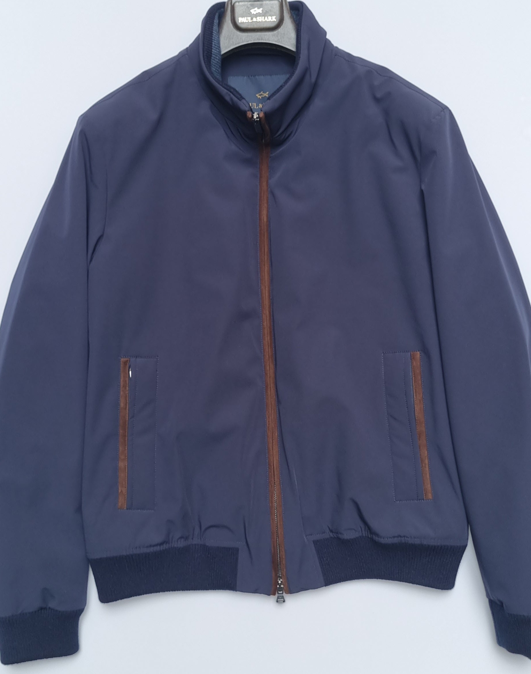 Stay dry and protected with the Paul & Shark Typhoon Jacket. Featuring advanced water-resistant and windproof technology, this sleek outerwear combines high performance with timeless style for any adventure.