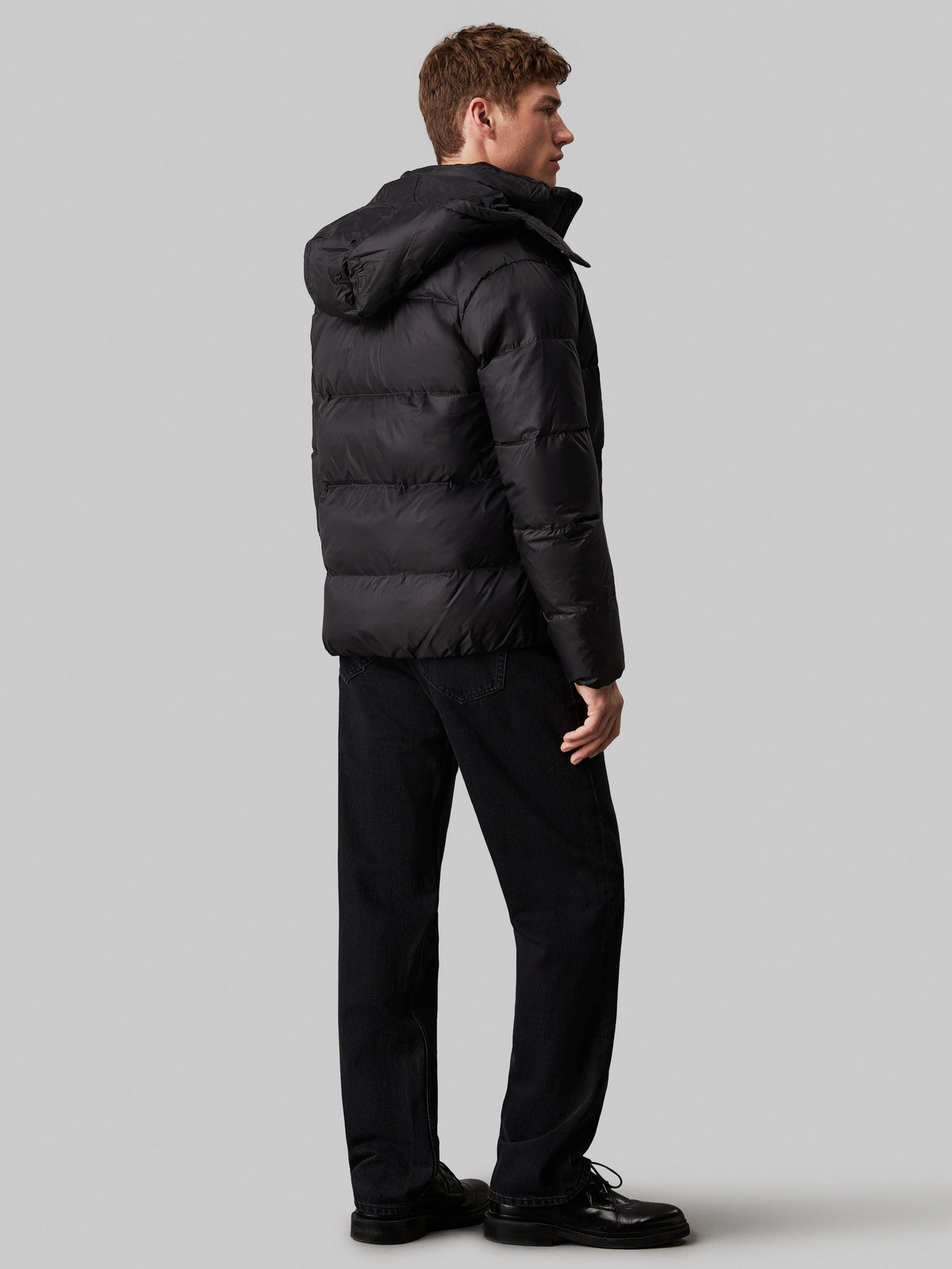 Calvin Klein Essential Down Jacket. Featuring lightweight down insulation and a sleek, minimalist design, this jacket is perfect for cold-weather comfort.