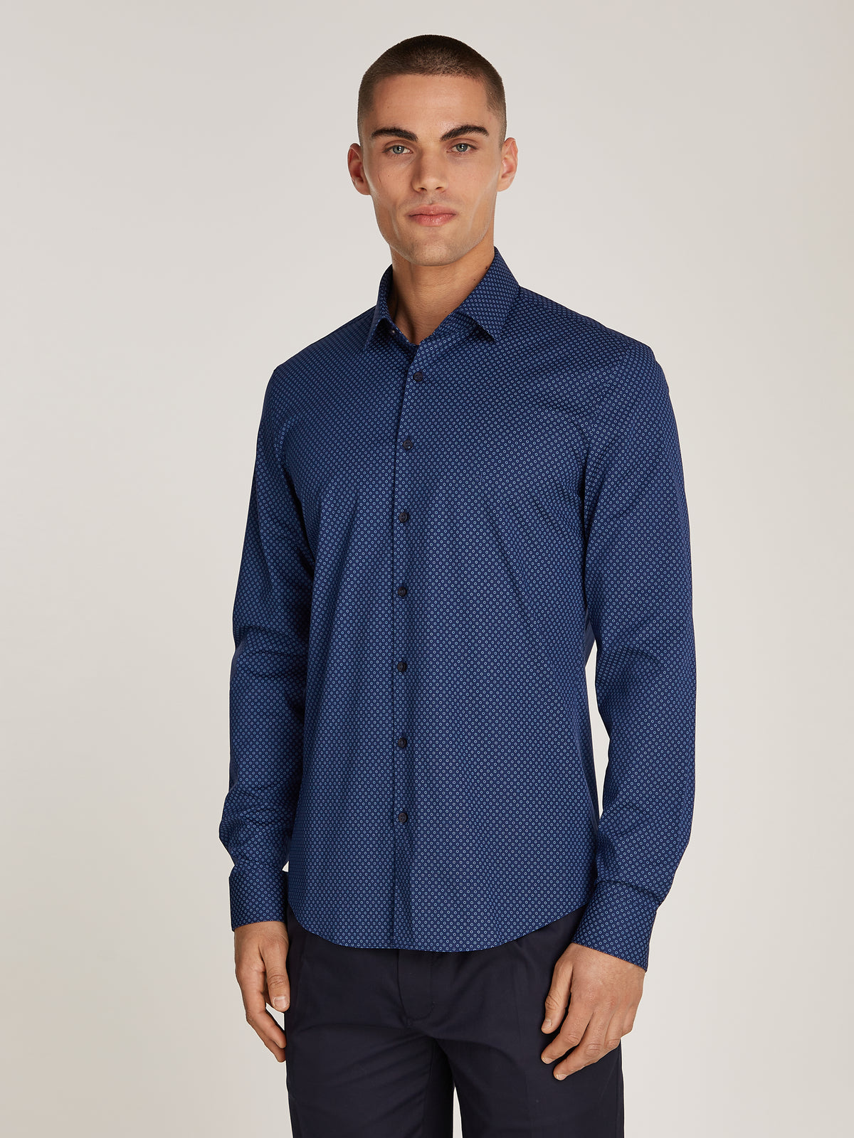 The Calvin Klein Poplin Business Print Shirt brings a modern twist to classic business attire. Made from high-quality poplin fabric