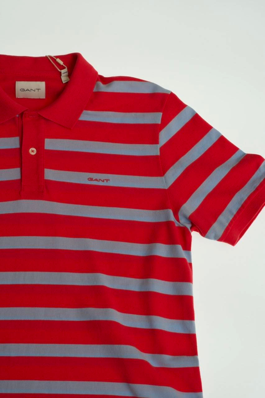 The GANT Striped Polo Shirt delivers timeless preppy style with a contemporary edge.