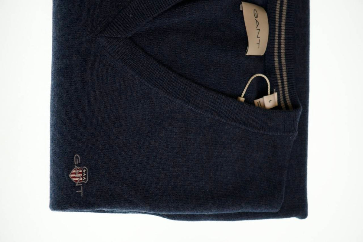 The GANT Cotton Vee Neck Jumper is a timeless knitwear essential designed for refined, all-season layering.
