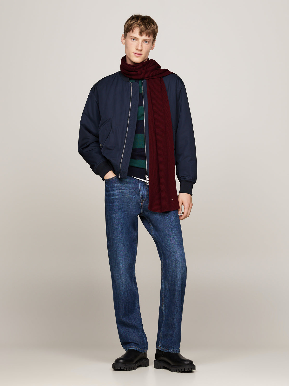 Elevate your winter wardrobe with the iconic Tommy Hilfiger Flag Pima Scarf.
