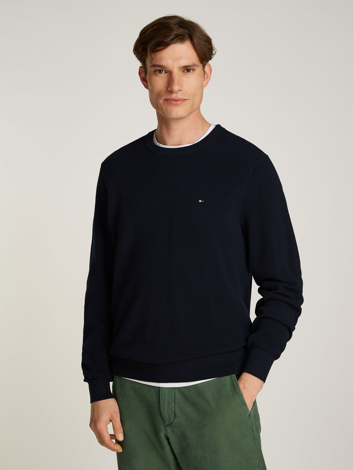 Tommy Hilfiger Herringbone Structure Crew Neck Jumper. Crafted from soft, premium fabric, this jumper features a sophisticated herringbone pattern that adds texture and depth to any casual or smart-casual outfit. 