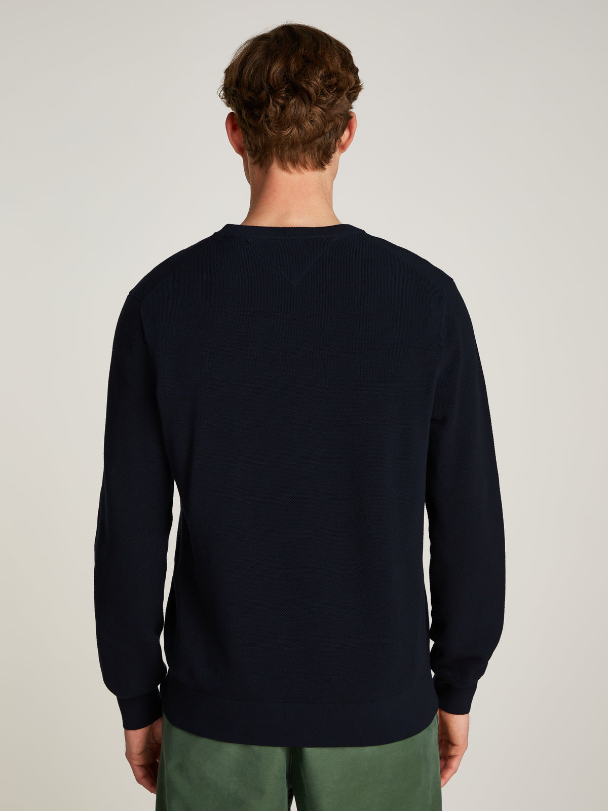 Tommy Hilfiger Herringbone Structure Crew Neck Jumper. Crafted from soft, premium fabric, this jumper features a sophisticated herringbone pattern that adds texture and depth to any casual or smart-casual outfit. 