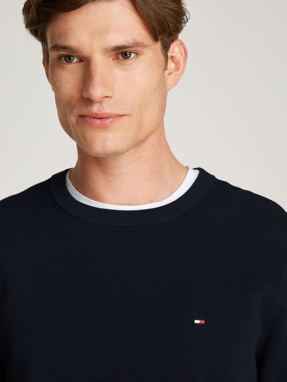 Tommy Hilfiger Herringbone Structure Crew Neck Jumper. Crafted from soft, premium fabric, this jumper features a sophisticated herringbone pattern that adds texture and depth to any casual or smart-casual outfit. 