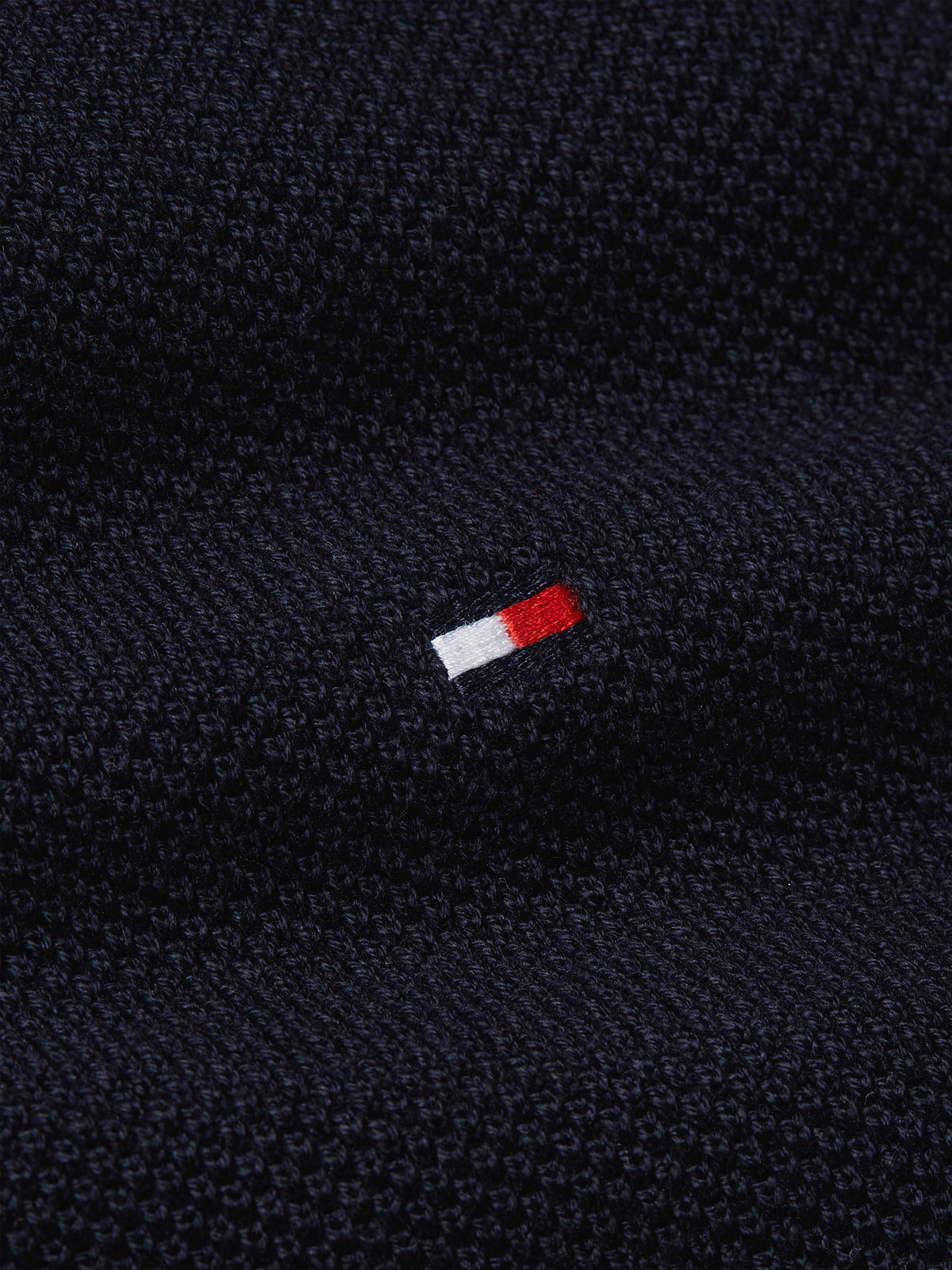 Tommy Hilfiger Herringbone Structure Crew Neck Jumper. Crafted from soft, premium fabric, this jumper features a sophisticated herringbone pattern that adds texture and depth to any casual or smart-casual outfit. 